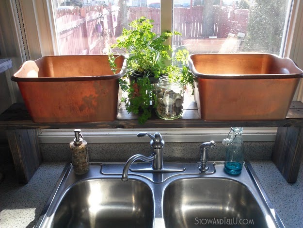 Keep a small kitchen counter de-cluttered with a diy over the kitchen sink shelf that is large enough to hold dish bins until you have time to wash the dishes from Stow and Tell U