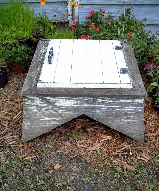 A garden table repurposed from an old weather vane cupola and a cabinet door - diy-table-garden-furniture - StowAndTellU.com