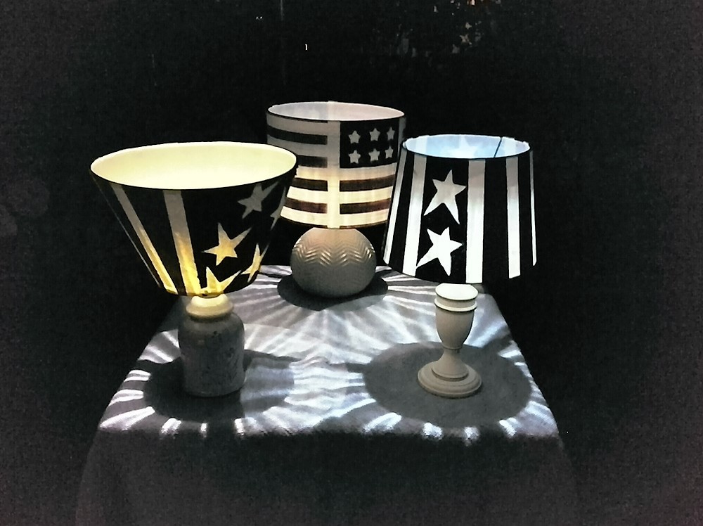 Old table lamps are painted red, white and blue and turned into patriotic outdoor solar lamps - StowAndTellU.com