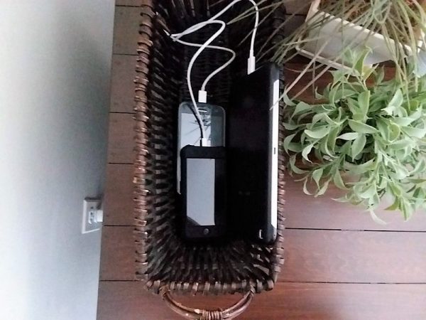 Table and Phones in basket on table top