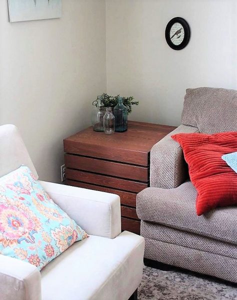 Side Crate Table in Living Room with ugly stain