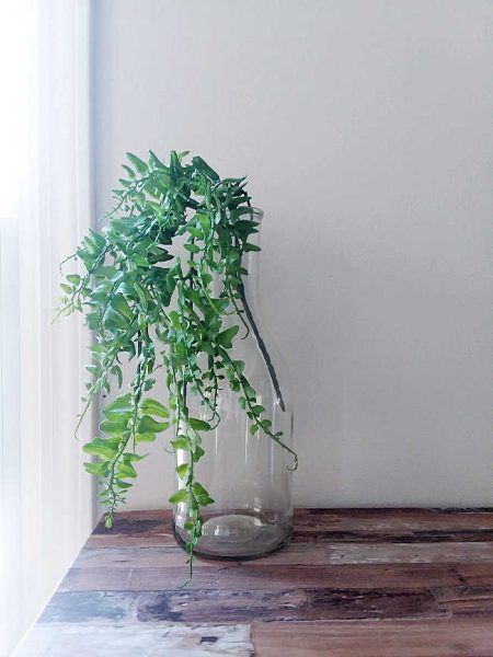 faux plant in glass vase