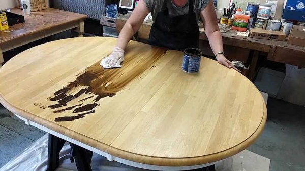 Staining a store table top