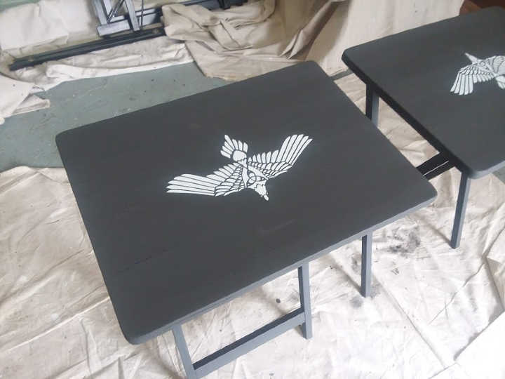 White Tribal Bird Stenciled on dark gray chalk paint table