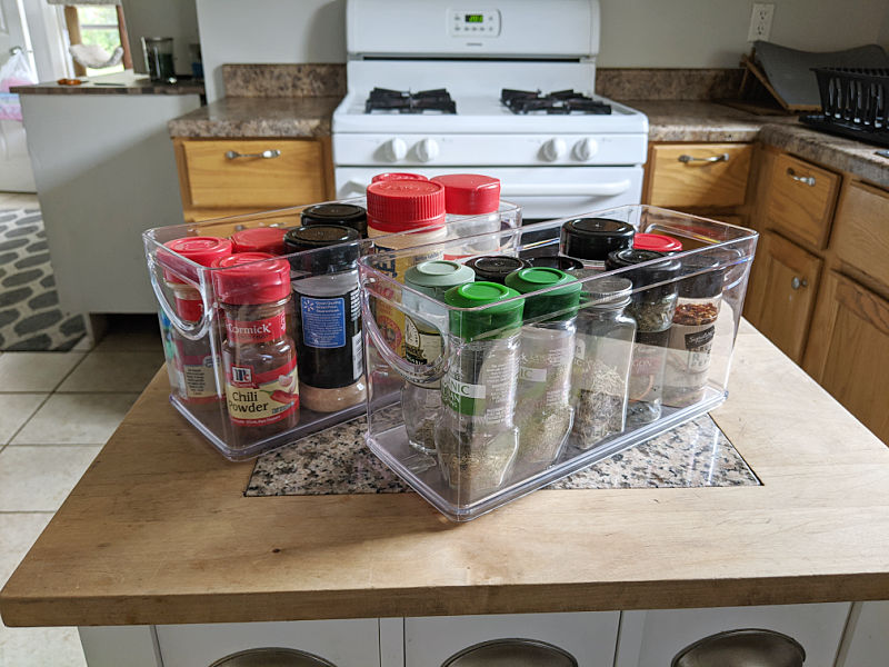 Clear plastic bins filled with spice jars