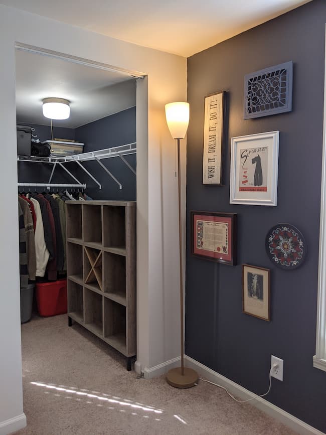 Dark blue painted walls and closet, cube storage